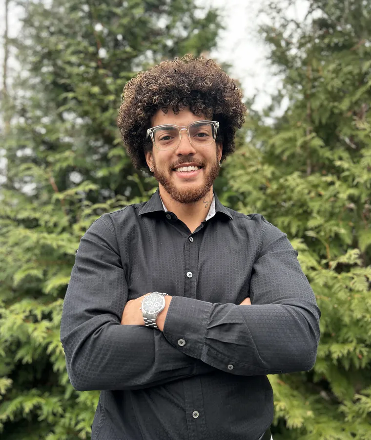 Joe Williams, the person behind Get Key Solutions, smiling with his arms crossed outdoors